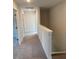 Well-lit hallway with neutral carpet and white trim at 145 Surles Landing Way, Benson, NC 27504