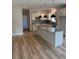 Kitchen with granite counters, white cabinets, and a large island at 145 Surles Landing Way, Benson, NC 27504