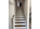 Staircase with hardwood steps and white risers at 145 Surles Landing Way, Benson, NC 27504