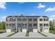 Four-unit townhome building with attached garages and neutral-toned siding at 1508 Indigo Creek Dr # 1196D, Zebulon, NC 27597