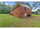 Rear view of brick home showcasing the back yard at 1558 Harper St, Rocky Mount, NC 27801