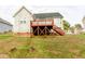 House exterior with red deck and stairs at 1610 Rogers Pointe Ln, Creedmoor, NC 27522