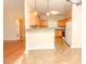 Bright kitchen with ample wood cabinets, gray countertops, and tiled floor at 1610 Rogers Pointe Ln, Creedmoor, NC 27522