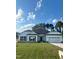 White house with a black roof and two-car garage at 1684 Pecan Drive # 43, Nashville, NC 27856
