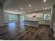 Open kitchen with island and hardwood floors at 1684 Pecan Drive # 43, Nashville, NC 27856