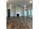 Spacious living room with fireplace and hardwood floors at 1684 Pecan Drive # 43, Nashville, NC 27856