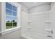 Bathroom with a shower/tub combo and window at 1783 Ballard Rd # Apex Georgian, Fuquay Varina, NC 27526