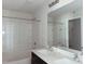 Bathroom featuring a double sink vanity and a shower-tub combination with tiled walls at 204 S Beaumont Ave, Burlington, NC 27217