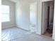 Bright bedroom with a large window and an open closet at 204 S Beaumont Ave, Burlington, NC 27217