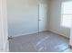A bedroom showing the door and window at 204 S Beaumont Ave, Burlington, NC 27217