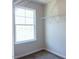 Walk-in closet with metal shelving and a window providing natural light at 204 S Beaumont Ave, Burlington, NC 27217