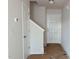 Entryway featuring white walls and doors, with a staircase leading to the upper level at 204 S Beaumont Ave, Burlington, NC 27217