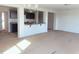 Open-concept living room with kitchen view featuring recessed lighting and natural light at 204 S Beaumont Ave, Burlington, NC 27217