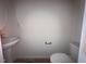 Powder room featuring a pedestal sink and a toilet at 204 S Beaumont Ave, Burlington, NC 27217