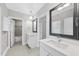 Modern bathroom with double vanity and a view of a bathtub at 2105 Dunhill Dr, Raleigh, NC 27608