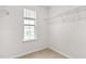 Walk-in closet with wire shelving and a window at 229 Starlight St, Sanford, NC 27330