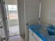 Bathroom with blue countertop and a doorway that leads to another room at 266 Weddington Way, Benson, NC 27504