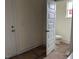 The bathroom features a toilet and blue countertop with an open door at 266 Weddington Way, Benson, NC 27504
