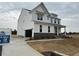 Charming two-story home with attached garage, stone accents, and a well manicured lawn at 266 Weddington Way, Benson, NC 27504