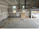 A spacious garage with two windows and an open door at 266 Weddington Way, Benson, NC 27504