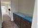 Butler's pantry with ample counter space, cabinets, and views of the backyard at 266 Weddington Way, Benson, NC 27504