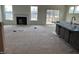 This living room has a fireplace, windows, sliding glass door and kitchen island at 266 Weddington Way, Benson, NC 27504