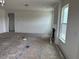 Bright living room with fireplace, large windows, and neutral walls creating a cozy space at 266 Weddington Way, Benson, NC 27504