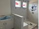 Newly tiled walk-in shower with tiled accent wall and new fixtures at 266 Weddington Way, Benson, NC 27504