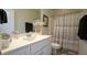 Modern bathroom with white vanity and gray accents at 317 Everly Mist Way, Wake Forest, NC 27587