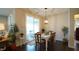 Bright dining area with sliding glass doors to patio and hardwood floors at 317 Everly Mist Way, Wake Forest, NC 27587