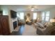 Spacious living room with fireplace and large windows at 317 Everly Mist Way, Wake Forest, NC 27587