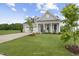 Gray house with white trim, two-car garage, and landscaped lawn at 40 Eagle Crest Ct # Clayton Low Country, Lillington, NC 27546