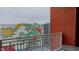 Brick balcony with view of a colorful city mural at 400 W North St # 820, Raleigh, NC 27603