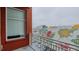 Brick balcony overlooking city mural and parking at 400 W North St # 820, Raleigh, NC 27603