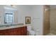 Bathroom with granite vanity, large mirror, and shower at 400 W North St # 820, Raleigh, NC 27603