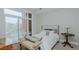 Bedroom with a queen-size bed and balcony access at 400 W North St # 820, Raleigh, NC 27603