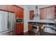 Modern kitchen with stainless steel appliances and dark granite countertops at 400 W North St # 820, Raleigh, NC 27603