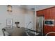 Modern kitchen with stainless steel appliances and dark granite countertops at 400 W North St # 820, Raleigh, NC 27603