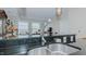 Modern kitchen with stainless steel appliances and dark granite countertops at 400 W North St # 820, Raleigh, NC 27603