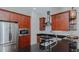 Modern kitchen with stainless steel appliances and dark granite countertops at 400 W North St # 820, Raleigh, NC 27603