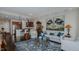 Open concept living area showcasing a kitchen, hardwood floors, and comfortable seating at 400 W North St # 820, Raleigh, NC 27603
