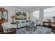 Spacious living room with hardwood floors, large windows, and comfortable seating at 400 W North St # 820, Raleigh, NC 27603