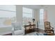 Bright living room with hardwood floors, large windows, and comfortable seating at 400 W North St # 820, Raleigh, NC 27603