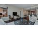 Spacious living room with hardwood floors, comfortable seating, and open kitchen area at 400 W North St # 820, Raleigh, NC 27603