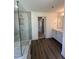 A bathroom featuring a shower with glass door and a vanity with double sinks at 427 Rising Star Dr, Clayton, NC 27520