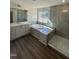 This bathroom features a soaking tub, shower with glass door, and double sink vanity at 427 Rising Star Dr, Clayton, NC 27520