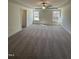 This bedroom has a ceiling fan, a tray ceiling, and a view of the surrounding land at 427 Rising Star Dr, Clayton, NC 27520