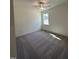 Cozy bedroom with neutral carpet, ample natural light, and a ceiling fan at 427 Rising Star Dr, Clayton, NC 27520