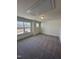 This bedroom has a neutral carpet, a window, and overhead lighting at 427 Rising Star Dr, Clayton, NC 27520