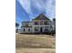 Elegant two-story home with a covered front porch and meticulous yard at 427 Rising Star Dr, Clayton, NC 27520